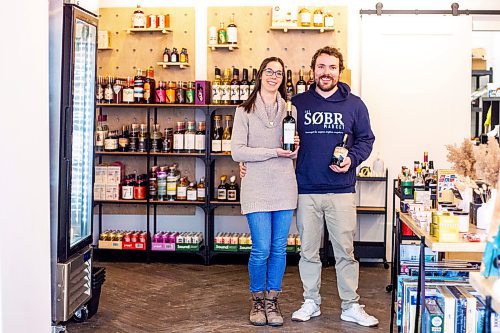 MIKAELA MACKENZIE / WINNIPEG FREE PRESS

Jessie and Shane Halliburton, co-owners of The Sobr Market, pose for a photo in their new store in the Exchange District in Winnipeg on Thursday, Feb. 2, 2023. For Gabby story.

Winnipeg Free Press 2023.