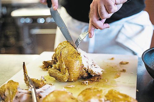 MIKAELA MACKENZIE / WINNIPEG FREE PRESS



Liam Martin cuts into the perfectly roasted chicken at the RRC Polytech kitchen in Winnipeg on Friday, Aug. 19, 2022.  For AV Kitching story.

Winnipeg Free Press 2022.