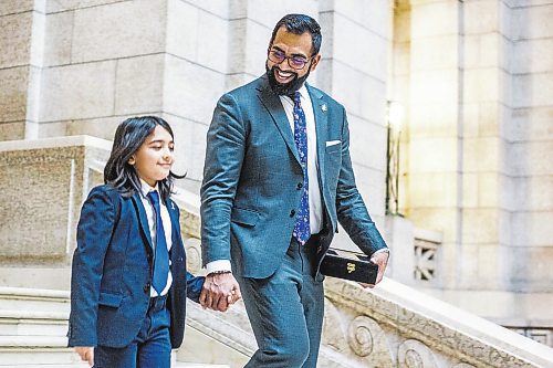 MIKAELA MACKENZIE / WINNIPEG FREE PRESS

Obby Khan, new minister responsible for sport, culture and heritage, minister responsible for the Manitoba Centennial Centre Corp. and minister responsible for Travel Manitoba, walks down the stairs with his son, Sufiyan Morrish-Khan (ten), after being sworn in as the first Muslim cabinet minister in Manitoba at the Manitoba Legislative Building in Winnipeg on Monday, Jan. 30, 2023. For Carol/Danielle story.

Winnipeg Free Press 2023.