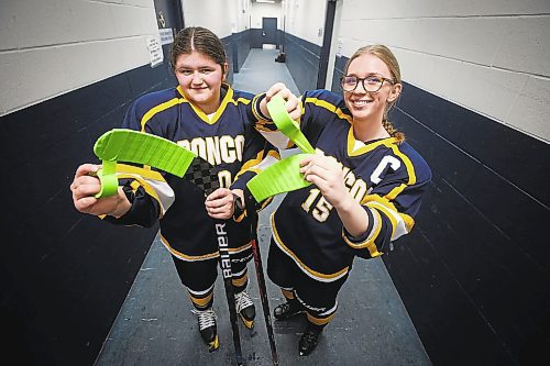 JOHN WOODS / WINNIPEG FREE PRESS
JH Bruns Broncos&#x2019; Kadence Morin (10), left, and Emma-Rae Wallis (15) with green tape on their sticks before high school action against the Garden City Gophers at JH Bruns high school in Winnipeg on Monday, January 23, 2023. The green tape on the sticks is an initiative called Buddy Check for Jesse to help create awareness for mental health in youth sport.

Re: Sanderson
