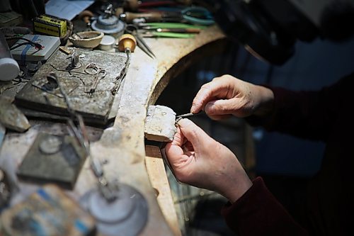 Longtime Brandon goldsmith Dat Tao refinishes a ring in his workshop at TCM Goldsmith in downtown Brandon. (Tim Smith/The Brandon Sun)