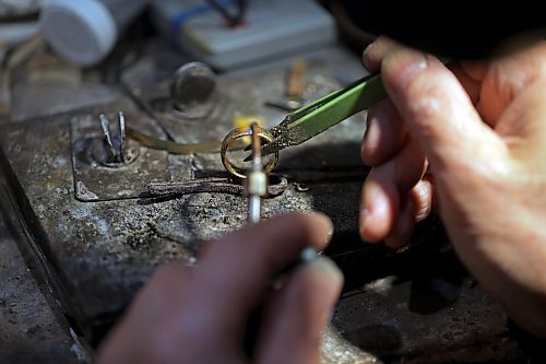 Longtime Brandon goldsmith Dat Tao refinishes a ring in his workshop at TCM Goldsmith in downtown Brandon. (Tim Smith/The Brandon Sun)