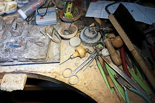 Dat Tao's work desk is abundant with the tools of his trade including pliers, a jeweller’s saw, hand and needle files, drill bits and soldering tools. (Tim Smith/The Brandon Sun)