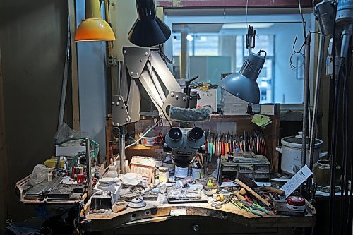 Dat Tao's work desk is abundant with the tools of his trade including pliers, a jeweller’s saw, hand and needle files, drill bits and soldering tools. (Tim Smith/The Brandon Sun)