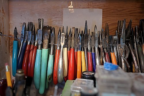 Dat Tao's work desk is abundant with the tools of his trade including pliers, a jeweller’s saw, hand and needle files, drill bits and soldering tools. (Tim Smith/The Brandon Sun)