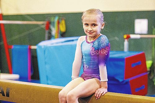 MIKAELA MACKENZIE / WINNIPEG FREE PRESS

Six-year-old Anastasia Rezmikova poses for a photo at Dakota Gymnastics Academy in Winnipeg on Tuesday, Jan. 31, 2023. Anastasia won gold at a gymnastics competition in Brandon last weekend. It&#x573; been a long journey for her both in gymnastics and life - with her mother and sister, they fled Ukraine last year. For Kevin story.

Winnipeg Free Press 2023.