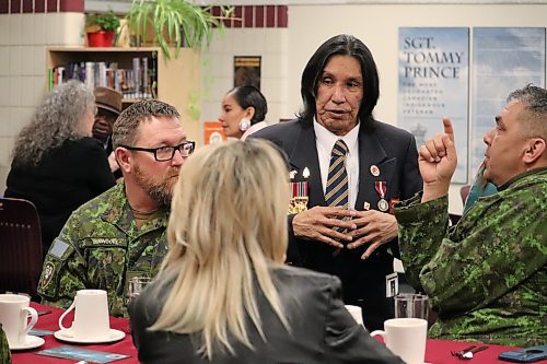 Tommy Prince Jr. chats with members of 2nd Battalion, Princess Patricia's Canadian Light Infantry during the grand opening of the Tommy Prince Library on Friday. Prince Jr.'s father, who is the library's namesake, fought with the 2nd Battalion, Princess Patricia's Canadian Light Infantry during the Korean War. (Kyle Darbyson/The Brandon Sun) 