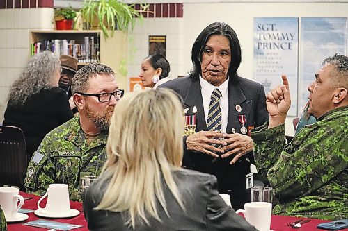 Tommy Prince Jr. chats with members of 2nd Battalion, Princess Patricia's Canadian Light Infantry during the grand opening of the Tommy Prince Library on Friday. Prince Jr.'s father, who is the library's namesake, fought with the 2nd Battalion, Princess Patricia's Canadian Light Infantry during the Korean War. (Kyle Darbyson/The Brandon Sun) 