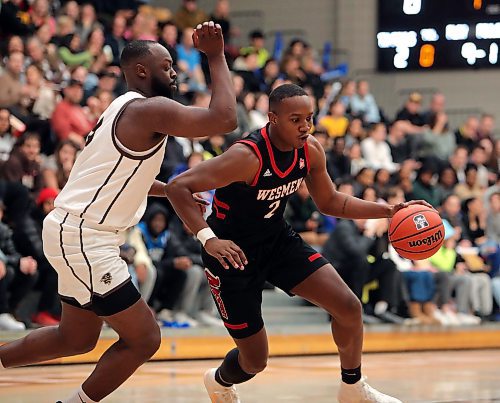JASON HALSTEAD / WINNIPEG FREE PRESS

University of Winnipeg Wesmen guard Emmanuel Thomas drives to the hoop against the University of Manitoba Bisons during Canada West university basketball action on Feb. 3, 2023, at Investors Group Athletic Centre at the University of Manitoba.