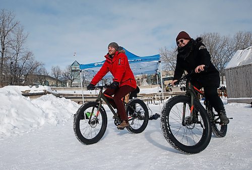 JOHN WOODS / WINNIPEG FREE PRESS
Ariel Desrochers, sustainable transporation coordinator with Green Action Centre (GAC), right, and Sean Birkett, sustainability projects assistant at GAC, ride bikes at the kickoff of the 12th annual Jack Frost Challenge at the Forks Sunday, February 5, 2023. Participants pledge to do 130 kms of winter activity in the week long challenge.

Re: ?