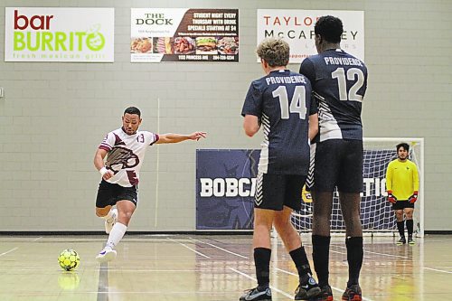 ACC Cougars Roberto Alonzo winds up for a free kick against the Providence Pilots in MCAC men's futsal at Henry Champ Gymnasium on Saturday. (Thomas Friesen/The Brandon Sun)