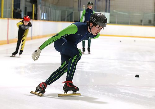 Adrian Lanoie of the Westman Speed Skating Club powers around a corner during a recent training session at the Sportsplex. (Perry Bergson/The Brandon Sun)