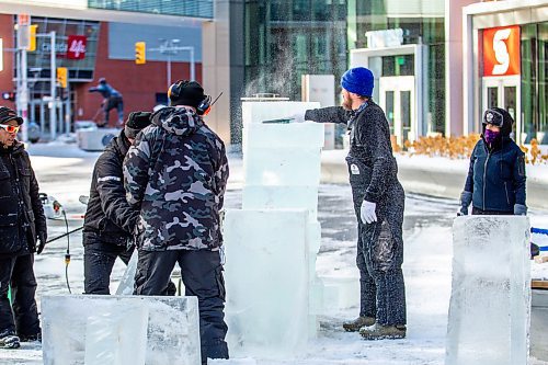 MIKAELA MACKENZIE / WINNIPEG FREE PRESS

The ice carving teams work together to stack ice blocks in preparation for ice carving at True North Square in Winnipeg on Tuesday, Feb. 7, 2023. For &#x2014; story.

Winnipeg Free Press 2023.