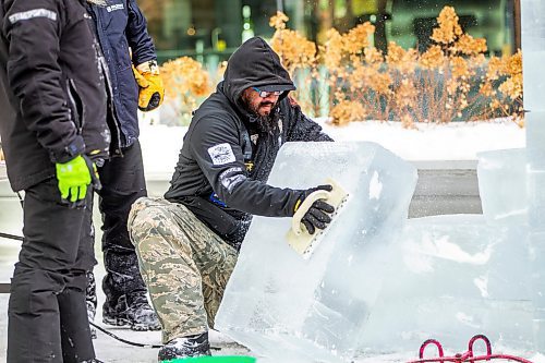 MIKAELA MACKENZIE / WINNIPEG FREE PRESS

Julio Martnez roughens up the surface of an ice block to stack it in preparation for ice carving at True North Square in Winnipeg on Tuesday, Feb. 7, 2023. For &#x460;story.

Winnipeg Free Press 2023.