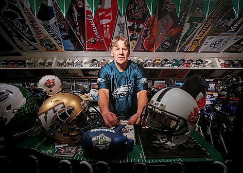 JOHN WOODS / WINNIPEG FREE PRESS
Winnipegger Dave Dech, 60, shows off his mini football helmet and sports memorabilia collection.