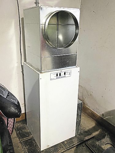 Marc LaBossiere / Winnipeg Free Press
This nearly 40-year-old electric furnace found a new home in one of the garage stalls.