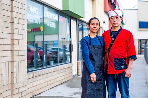 MIKAELA MACKENZIE / WINNIPEG FREE PRESS

Momo Japanese and Korean Restaurant co-owners Lisa Le and Sunpil Han pose for a photo in front of their business, which was recently broken into, in Winnipeg on Wednesday, Feb. 8, 2023. For Erik story.

Winnipeg Free Press 2023.