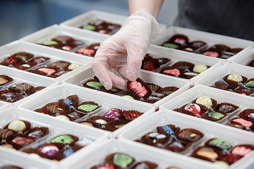MIKE DEAL / WINNIPEG FREE PRESS
An employee puts a LOVE chocolate into a box as the shop gets ready for the Valentine's Day rush.
Constance Menzies owner of Constance Popp Chocolatier at 180 Provencher Blvd, with some of her Valentine&#x2019;s offerings.
See Eva Wasney story
230209 - Thursday, February 09, 2023.