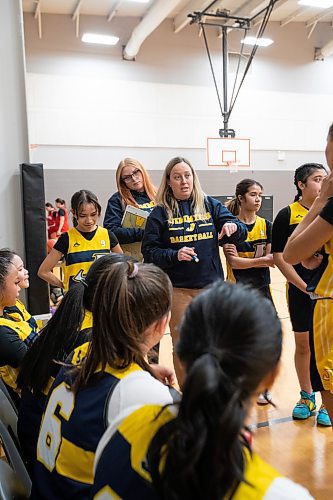 DARCY FINLEY / WINNIPEG FREE PRESS 

St. James Collegiate varsity girls basketball coach Ashley van Aggelen, with assistant coach Brynn Rosjer-Doyle, behind, talks to players during a game at La Salle Rec Centre - Friday, February 03, 2023.