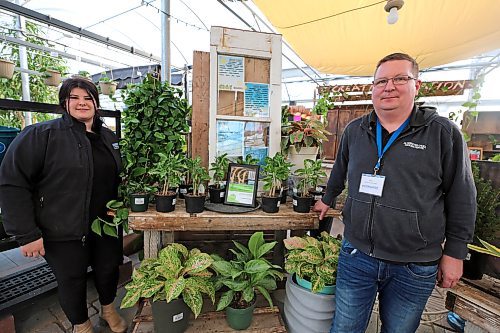 Alternative Group office manager Emma Griffin (left) and marketing manager Mike Mair (right) show off the award of merit the company's garden centre recently received from the Manitoba Nursery Landscape Association. (Colin Slark/The Brandon Sun)