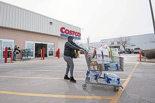Mike Sudoma / Winnipeg Free Press
Shoppers exit the Costco on St James St with carts full of groceries Tuesday afternoon in preparation for Wednesday night&#x2019;s reported snowstorm
April 12, 2022