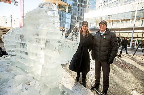 MIKE DEAL / WINNIPEG FREE PRESS
Downtown Winnipeg BIZ CEO Kate Fenske with Mayor Scott Gillingham look and the ice sculpture that was revealed during the launch of Winter Wanderland Friday morning in True North Square. 
230210 - Friday, February 10, 2023.