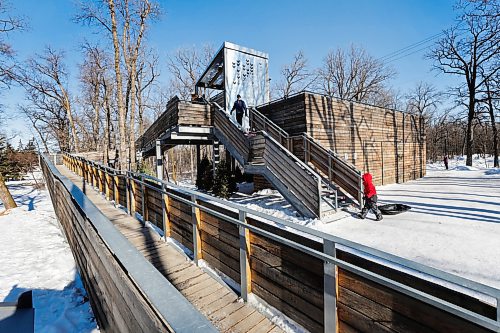 RUTH BONNEVILLE / WINNIPEG FREE PRESS 

LOCAL - St. Vital Slide Manitoboggan 

Photos of the slide and its various special features.

Manitobogga, a multi-level toboggan slide located at St. Vital park, has received an Award of Merit at the 2022 Prairie Design Awards and a 2020 Award of Excellence from the Canadian Society of Landscape Architects. It was recognized by the International Olympic Committee in 2019, as well as by the International Paralympic Committee, in acknowledgment of its barrier-free and universally accessible design. 

Innovative design features include 
two chutes at different heights. The iced chutes, with banked-up sides, make for a fast slide, metal grates on the steps to discourage snow accumulation, there is a universally accessible ramp. The structure&#x573; upper canopy is incised with motifs that riff on Mary Maxim sweaters and their warming connotations. A a ground-level warming area, with an interior painted a welcoming red. 

For story on Winnipeg hosting Winter Cities Shake-up Conference,  February 15-17, 2023, which features designers, planners, entrepreneurs, tourism operators, cultural workers, community organizers and happiness experts talking about how cities and their citizens can make the most of winter.

Feb 9th,  2023