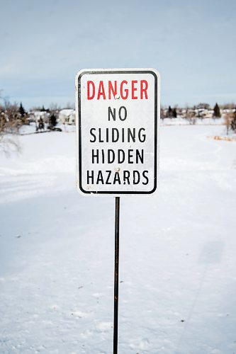 Mike Sudoma/Winnipeg Free Press
One of the two no sliding signs posted atop a snow covered hill in the Whyte Ridge neighbourhood Friday
February 10, 2023 