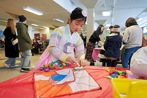 DAVID LIPNOWSKI / WINNIPEG FREE PRESS

Temi Kim (8 years-old) enjoys decorating a traditional Korean Kite during K-Culture Festival at Grant Park High School Saturday February 11, 2023.