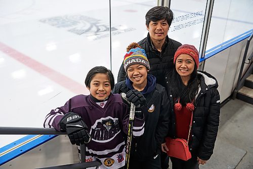 DAVID LIPNOWSKI / WINNIPEG FREE PRESS

Finn Batoon (left) with his sister Zoe Anne, father Gail, and mother Marcel Anne photographed at the Seven Oaks Arena  Saturday February 11, 2023.
Finn moved to Canada from The Philippines in 2019, and the 11-year-old has become so adept at the sport that he now part of the U13 Raiders team after trying out last September.

This Story forms parts of a bigger feature on how a once-alien sport has now become part and parcel of newcomer and immigrant children&#x2019;s lives.
