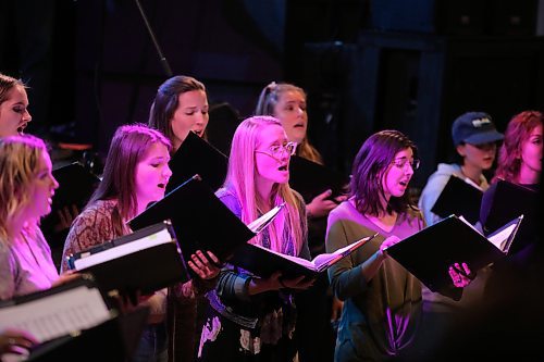 Members of the Konektis choir take their position on stage at The 40 nightclub in Brandon to perform some old and new material for local bar patrons on Saturday night. (Kyle Darbyson/The Brandon Sun)