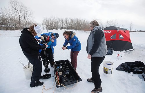 JOHN WOODS / WINNIPEG FREE PRESS
Sean Scott, volunteer, from left, Roselle Turenne, owner of Prairie Gal Fishing, and sisters, Dana and Sherry Urbanski,  set up an auger during a workshop at Fort Whyte Sunday, February 12, 2023. Turenne runs fishing workshops for women where she teaches women the ins and outs of ice-fishing.

Re: Sanderson