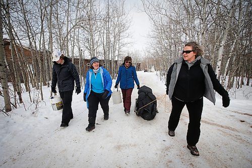 JOHN WOODS / WINNIPEG FREE PRESS
Sean Scott, volunteer, from left, Roselle Turenne, owner of Prairie Gal Fishing, and sisters, Dana and Sherry Urbanski, head to the lake during a fishing workshop at Fort Whyte Sunday, February 12, 2023. Turenne runs fishing workshops for women where she teaches women the ins and outs of ice-fishing.

Re: Sanderson