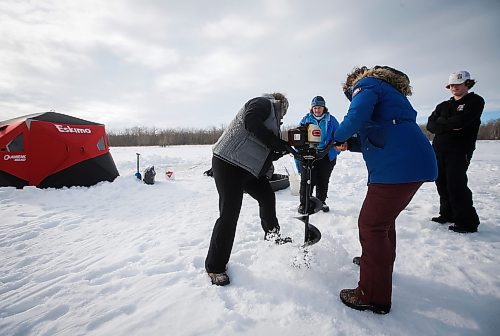 JOHN WOODS / WINNIPEG FREE PRESS
Sherry and Dana Urbanski, sisters, drill holes with an auger as Roselle Turenne, owner of Prairie Gal Fishing, and Sean Scott, volunteer, look on during a fishing workshop on a lake at Fort Whyte Sunday, February 12, 2023. Turenne runs fishing workshops for women where she teaches women the ins and outs of ice-fishing.

Re: Sanderson