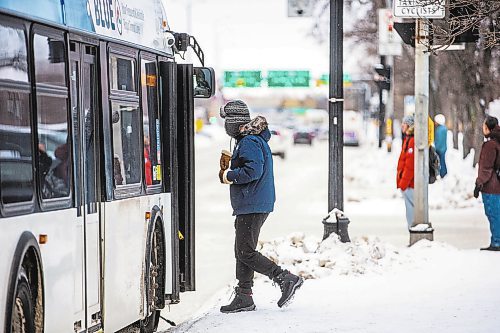 MIKAELA MACKENZIE / WINNIPEG FREE PRESS

Frank Zhang gets on his bus at a downtown Winnipeg Transit stop on Main Street at Broadway on Tuesday, Dec. 27, 2022. For Tyler story.
Winnipeg Free Press 2022.