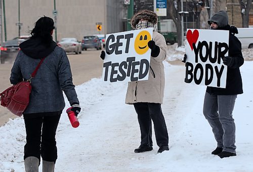 Folks with the Sexuality Education Resource Centre in Winnipeg hold posters with body-positive messages. SERC Brandon is promoting the annual Sexual and Reproductive Health Awareness Week campaign. (Winnipeg Free Press) 