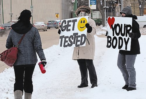 As part of Sexual &amp; Reproductive Health Awareness Week which runs February 9-13, Sexuality Education Resource Centre (SERC)  -Melanie Saindom, right and  Ann Singbeil and use message boards on York Ave this morning in an effort to promote pleasurable and sex positive safer sexual health messages &#x2013;Standup Photo- Feb 12, 2015   (JOE BRYKSA / WINNIPEG FREE PRESS)