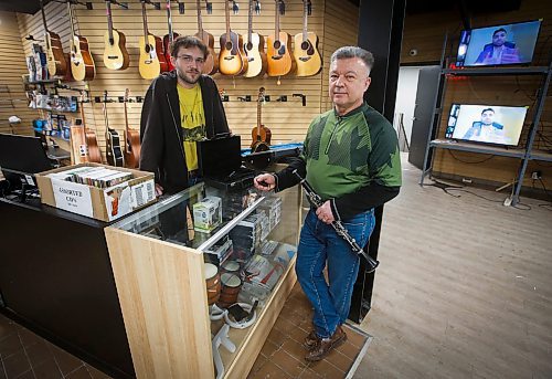 JOHN WOODS / WINNIPEG FREE PRESS
Sean Mychasiw, left, and Ray Bach of the local band Boys Road chat about instruments at the pawn shop where Mychasiw works Monday, February 13, 2023. The pair met when Bach was shopping for a saxophone. Mychasiw invited Bach to play in a gig with them when he heard him test out a saxophone.

Re: Waldman