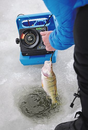 JOHN WOODS / WINNIPEG FREE PRESS
Roselle Turenne, owner of Prairie Gal Fishing, pulls a fish from a hole during a fishing workshop on a lake at Fort Whyte Sunday, February 12, 2023. Turenne runs fishing workshops for women where she teaches women the ins and outs of ice-fishing.

Re: Sanderson