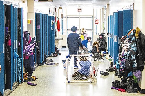 MIKAELA MACKENZIE / WINNIPEG FREE PRESS

A ball hockey game takes place in the hallway during a day of unstructured play at cole Dieppe in Winnipeg on Tuesday, Feb. 14, 2023. For Maggie story.

Winnipeg Free Press 2023.