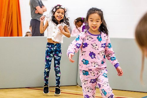 MIKAELA MACKENZIE / WINNIPEG FREE PRESS

Grade one students Era Inocencio (left) and Karen Liu jump and toss a ball around in the gym during a day of unstructured play at cole Dieppe in Winnipeg on Tuesday, Feb. 14, 2023. For Maggie story.

Winnipeg Free Press 2023.