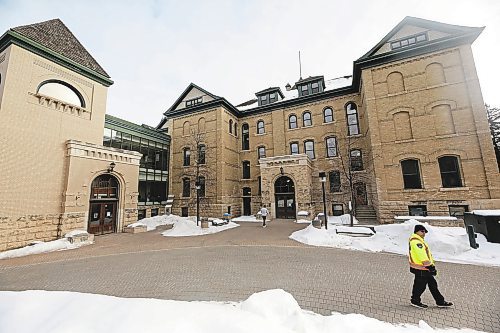 A security officer with Brandon University walks behind Clark Hall near the George T. Richardon Centre on a cold Wednesday morning. Brandon University has added extra security patrols on campus following the discovery of an unfired .22 catridge on campus. (Matt Goerzen/The Brandon Sun) 