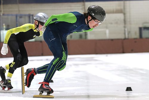 Adrian Lanoie of the Westman Speed Skating Club leads teammate Keagan Dyke into a turn at a recent training session at the Sportsplex. (Perry Bergson/The Brandon Sun)