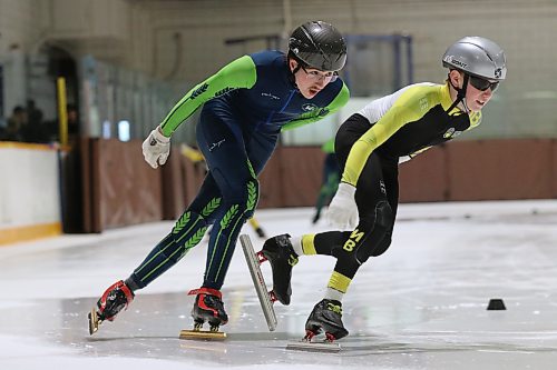 Adrian Lanoie of the Westman Speed Skating Club tucks in behind teammate Keagan Dyke during a drill at a recent training session at the Sportsplex. (Perry Bergson/The Brandon Sun)