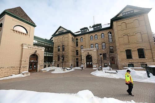 A security officer with Brandon University walks behind Clark Hall near the George T. Richardon Centre on a cold Wednesday morning. Brandon University has added extra security patrols on campus following the discovery of an unfired .22 catridge on campus. (Matt Goerzen/The Brandon Sun)