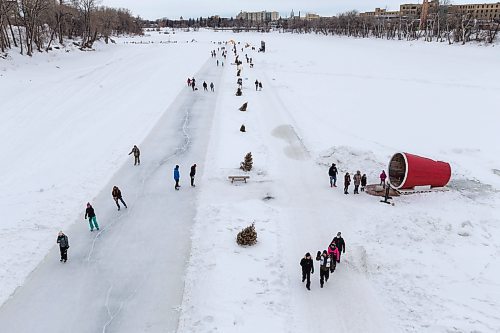 Daniel Crump / Winnipeg Free Press. People take advantage of warmer late winter weather by going for a walk, or skate, along the Red River on the Nestaweya River Trail near the Forks in Winnipeg, Saturday afternoon. March 5, 2022.