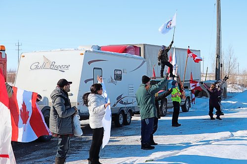 Westman residents greet members of the World Unity Convoy as they drive into the Husky gas station off of Highway 1 in Brandon on Thursday morning. (Kyle Darbyson/The Brandon Sun) 