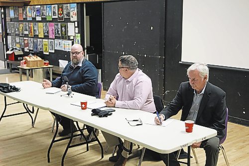 Coun. Shaun Cameron (Ward 4, left) speaks during a joint ward meeting at Vincent Massey High School on Thursday evening as the City of Brandon's general manager of operations Patrick Pulak (centre) and Coun. Barry Cullen (Ward 3, left) look on. (Colin Slark/The Brandon Sun)
