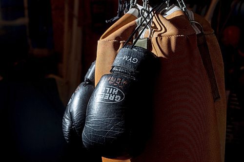 Mike Sudoma/Winnipeg Free Press
Eli Serada&#x2019;s boxing gloves hang on a heavy bag inside Serada&#x2019;s garage Thursday evening
February 16, 2023 