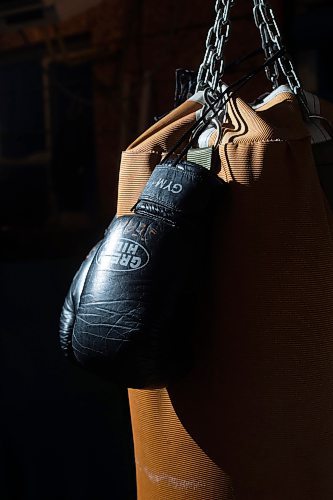 Mike Sudoma/Winnipeg Free Press
Eli Serada&#x2019;s boxing gloves hang on a heavy bag inside Serada&#x2019;s garage Thursday evening
February 16, 2023 